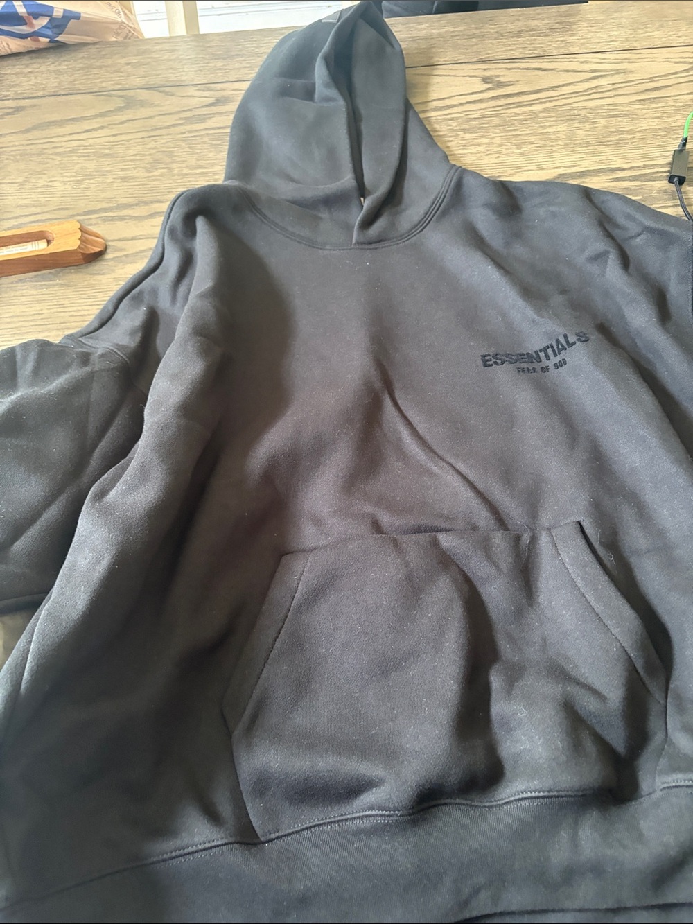 Essentials Black Hoodie with Subtle Chest Logo